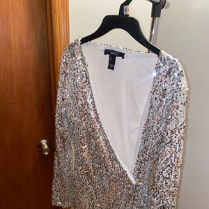 Silver Sparkly dress with slit on the side.